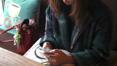 A woman uses an app on a mobile phone