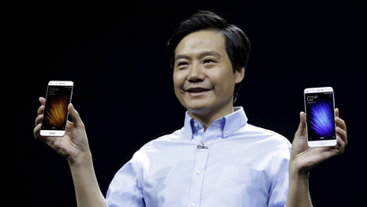Lei Jun, founder and CEO of China's mobile company Xiaomi, displays Xiaomi Mi 5 at its launch ceremony, in Beijing, China, February 24, 2016.