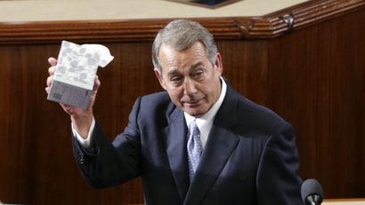 Outgoing House Speaker John Boehner (R-OH) waves his trademark box of tissues as he addresses colleagues prior to the election for the new Speaker of the U.S. House of Representatives on Capitol Hill in Washington October 29, 2015.