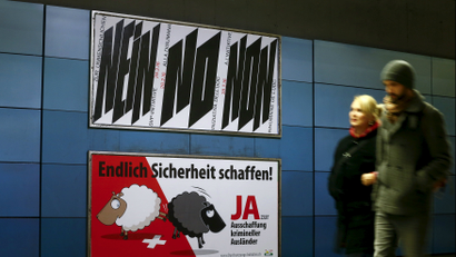 A poster of Swiss People's Party (SVP), demanding to vote for an initiative to deport criminal foreigners, is placed underneath another one against it at the central railway station in Zurich, Switzerland February 12, 2016. Switzerland will hold a binding referendum later this month on whether to subject any foreign resident to automatic deportation if convicted of offences running the gamut from murder to breaking the speed limit. The poster on top reads, "Say no to the inhuman SVP initiative" and the one underneath, "At last make things safer! Say yes to deportation of criminal foreigners". REUTERS/Arnd Wiegmann