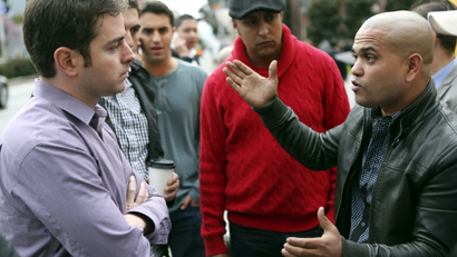 Uber driver Ramsi Reguii (R) expresses his grievances with Uber General Manager Ilya Abyzov during a protest to request for better pay and better communication with the private transportation service company outside Uber's office in San Francisco, California, January 27, 2014