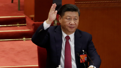 Chinese President Xi Jinping raises his hand as he takes a vote at the closing session of the 19th National Congress of the Communist Party of China at the Great Hall of the People, in Beijing, China October 24, 2017.