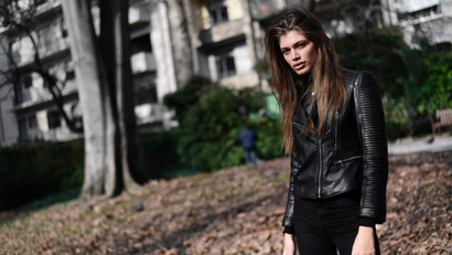 Valentina Sampaio delivers her best sultry stare in a black leather jacket