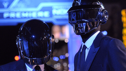 In this Dec. 11, 2010 file photo, musician Guy-Manuel de Homem-Christo, left, and musician Thomas Bangalter of the duo Daft Punk arrive at the premiere of the feature film "Tron: Legacy" in Los Angeles. Daft Punk have set a record on Spotify. The music service says the French electronic duo's song, "Get Lucky," had the biggest streaming day for a single track on Friday, April 19, 2013, in the United States and the United Kingdom. Spotify wouldn't release the number of streams.