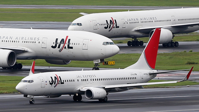 Japan Airlines (JAL) aircrafts are seen on the tarmac at Haneda airport in Tokyo September 19, 2012.
