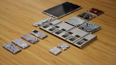 A Google Project Ara smartphone with modules scattered around it