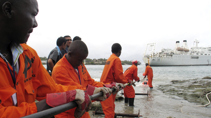 Contractors lay the East African Marine Cable (TEAMS) fiber optic cable from a ship in the Kenyan coastal city of Mombasa in 2009.