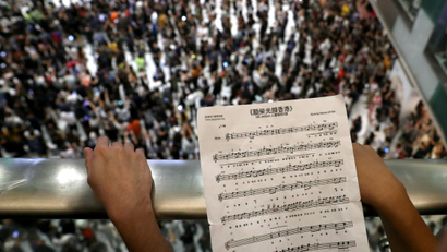 A participant holds sheet music of Hong Kong's anthem during a protest at New Town Plaza shopping mall in Hong Kong, China September 11, 2019.