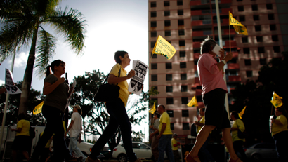 People protest outside the government pension headquarters in San Juan, Puerto Rico, Wednesday, Jan. 30, 2013.