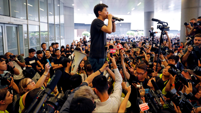 Pro-democracy activist Joshua Wong addresses the crowds outside the Legislative Council on June 17 2019
