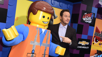 Cast member Chris Pratt poses with his character at the world premiere of "The Lego Movie 2: The Second Part" on Sunday, Feb. 2, 2019, in Los Angeles.