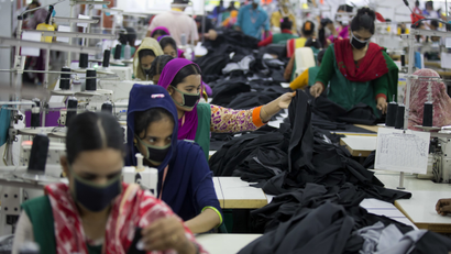 Bangladeshis work at a garment factory in Dhamrai, near Dhaka, Bangladesh