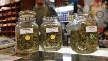 Jars of marijuana buds sit on the counter at the Denver Kush Club in north Denver. A simplified program will make it easier for thousands of people to seek the elimination of low-level marijuana convictions that occurred in Denver before recreational use became legal in Colorado, officials said Wednesday, Jan. 9, 2019.