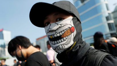 A masked anti-government protester attends a demonstration in Hong Kong, China, September 15, 2019.