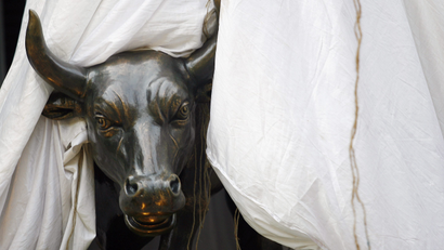 A bronze replica of a bull is seen at the gates of the Bombay Stock Exchange