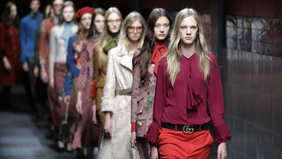 Models wear creations for Gucci women's Fall-Winter 2015-2016 collection, part of the Milan Fashion Week, unveiled in Milan, Italy, Wednesday, Feb. 25, 2015.
