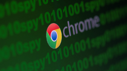 Google Chrome logo is seen near cyber code and words "spy" in this photo illustration.