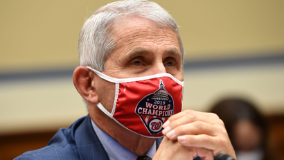 Close-up of Dr. Anthony Fauci with a red mask on.