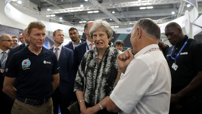 Britain's Prime Minister, Theresa May speaks with European Space Agency astronaut Tim Peake as she opens the Farnborough Airshow, in Farnborough, Britain July 16, 2018.