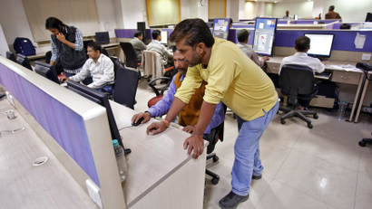 Employees work inside the office of Dainik Jagran newspaper in Noida