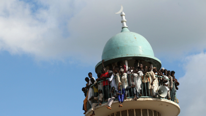 Spectators watch from a mosque minaret to try to get a better view of the Durbar festival parade in Zaria, Nigeria September 14, 2016. Picture taken September 14, 2016.