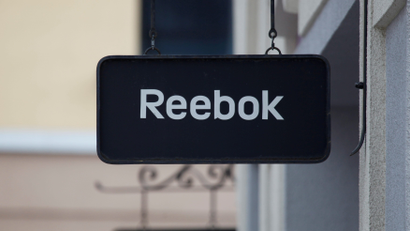 Boards with Reebok store logo are seen at a shopping center