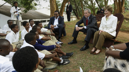 President George W Bush and first lady Laura Bush talk to students in Kigali about abstinence. in 2008.