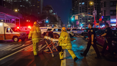 In this Sept. 17, 2016 file photo, first responders work near the scene of an explosion in Manhattan's Chelsea neighborhood, in New York. Although the pressure cooker bomb that wounded over two dozen people on the street went off in front of an apartment building for the blind, none of the building's residents were hurt in the blast. (AP Photo/Andres Kudacki, File)