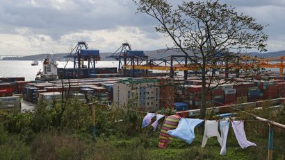 Stacked shipping containers are pictured at a commercial port in Vladivostok