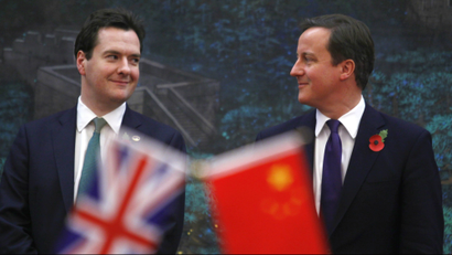 Britain's Prime Minister David Cameron (R) and Britain's Chancellor of the Exchequer George Osborne attend a signing ceremony with China's Premier Wen Jiabao (not pictured) at the Great Hall of the People in Beijing, China, 09 November 2010.