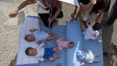 Babies on a mattress in Spain.