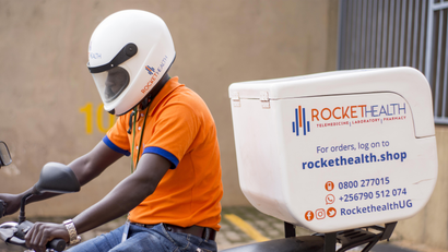 A man on a motorcycle with equipment for a telemedicine service called Rocket Health.