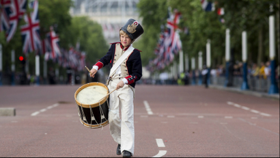Drummer parades along the mall in London, UK