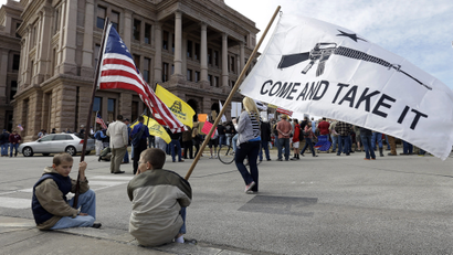 Children pictured with a pro-gun flag in Texas