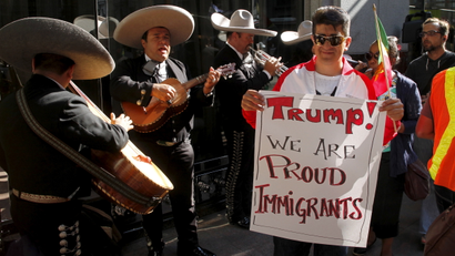 Recently-unionized workers and supporters march in front of a mariachi band outside the Trump International Hotel & Tower during a demonstration in support of immigrants in Toronto August 6, 2015. Trump is CEO of Trump Hotel Management Corp, which was hired to manage the operations of the hotel and residences at the tower.