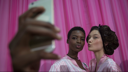 models taking a selfie