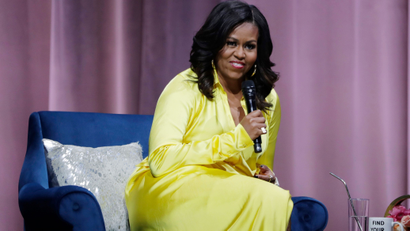 Former first lady Michelle Obama responds to questions as she is interviewed by actress Sarah Jessica Parker during an appearance for her book, "Becoming: An Intimate Conversation with Michelle Obama" at Barclays Center Wednesday, Dec. 19, 2018, in New York. (AP Photo/Frank Franklin II)