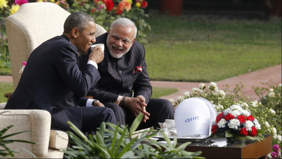 U.S. President Barack Obama and India's Prime Minister Narendra Modi (R) talk as they have coffee and tea together in the gardens of Hyderabad House in New Delhi January 25, 2015. Obama is visiting India for three days to attend Republic Day celebrations and meet with Indian leaders. bespoke, suit