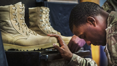 A U.S. soldier pays his respects at Bagram Air Field.
