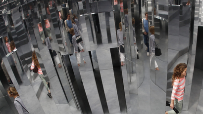 Visitors are reflected in the installation Mirror Maze by artist Es Devlin, at the Copeland Park in Peckham, south London, Britain September 21, 2016.