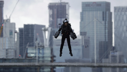 a man flying in a jetpack