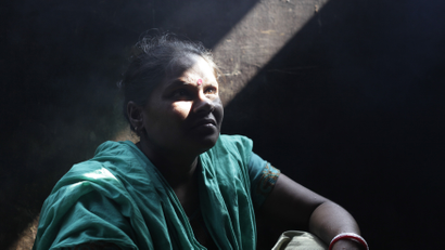 Sabita Rani, 35, who survived a devastating fire at a garment factory, sits in her kitchen in Savar November 30, 2012. Rani, an operator of Tazreen Fashions garment factory, escaped the fire which killed more than 100 workers on November 24.