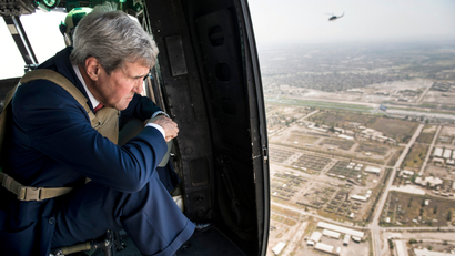 U.S. Secretary of State John Kerry looks out over Baghdad from a helicopter September 10, 2014. Kerry arrived in Baghdad on Wednesday as he began a tour of the Middle East to build military, political and financial support to defeat Islamic State militants controlling parts of Iraq and Syria.