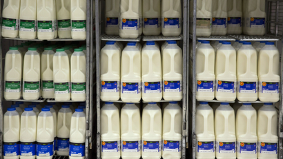Milk cartons are displayed at an Asda supermarket in London