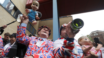 Supporters of the royal family celebrate outside the Lindo Wing of St Mary's Hospital after Britain's Catherine, the Duchess of Cambridge, gave birth to a son, in London