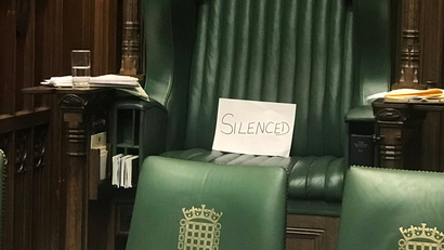 A piece of paper with the word "silenced" sits on the chair of the speaker of the UK parliament, in protest against its suspension for longer than usual at a critical time in British politics