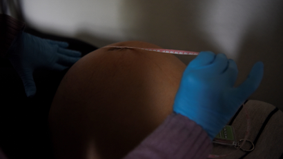 A pregnant woman has her belly measured