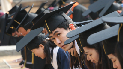 South Korean students bow as they pay homage to great sages during their graduation ceremony at Sungkyunkwan University in Seoul, South Korea, Friday, Feb. 24, 2012. (AP Photo/Ahn Young-joon
