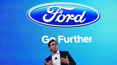 Ford Motor Co CEO Mark Fields speaks at the Ford press conference at the Consumer Electronics Show in Las Vegas, January 5, 2016. Ford said Tuesday it plans to triple to 30 the size of its fleet of self-driving test cars as part of an effort to accelerate autonomous vehicle development. REUTERS/Rick Wilking - GF10000283641