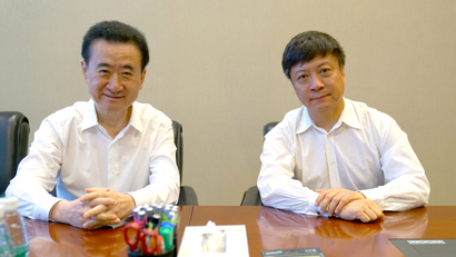 Chairman of Dalian Wanda Group Wang Jianlin meets with chairman of Sunac China Holdings Ltd Sun Hongbin in Beijing, China, July 10, 2017. Picture taken July 10, 2017. CAIXIN/Yang Yifan via REUTERS ATTENTION EDITORS - THIS IMAGE WAS PROVIDED BY A THIRD PARTY. CHINA OUT. NO COMMERCIAL OR EDITORIAL SALES IN CHINA. - RTX3B3VL